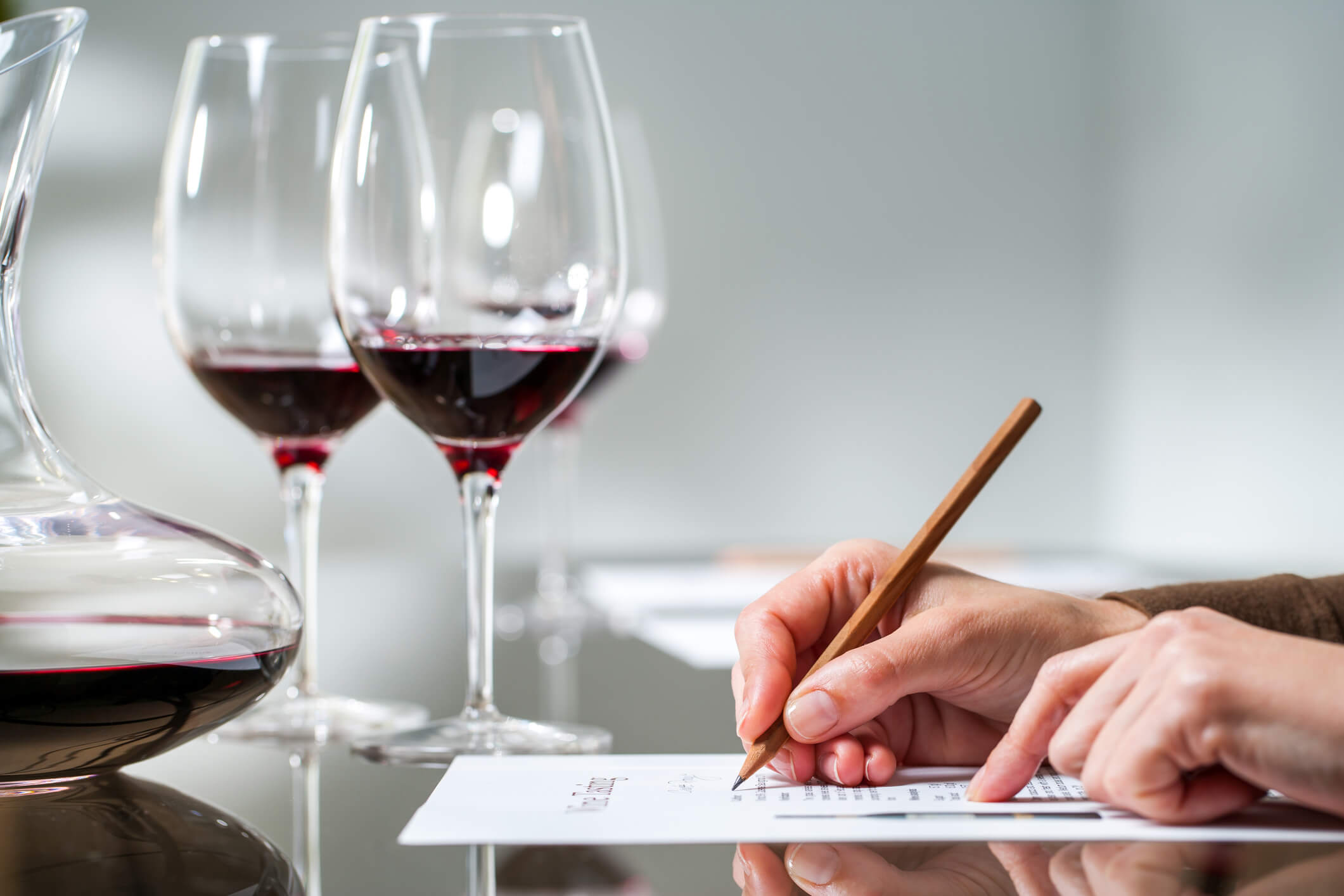 Wine tasting notes with glasses and decanter