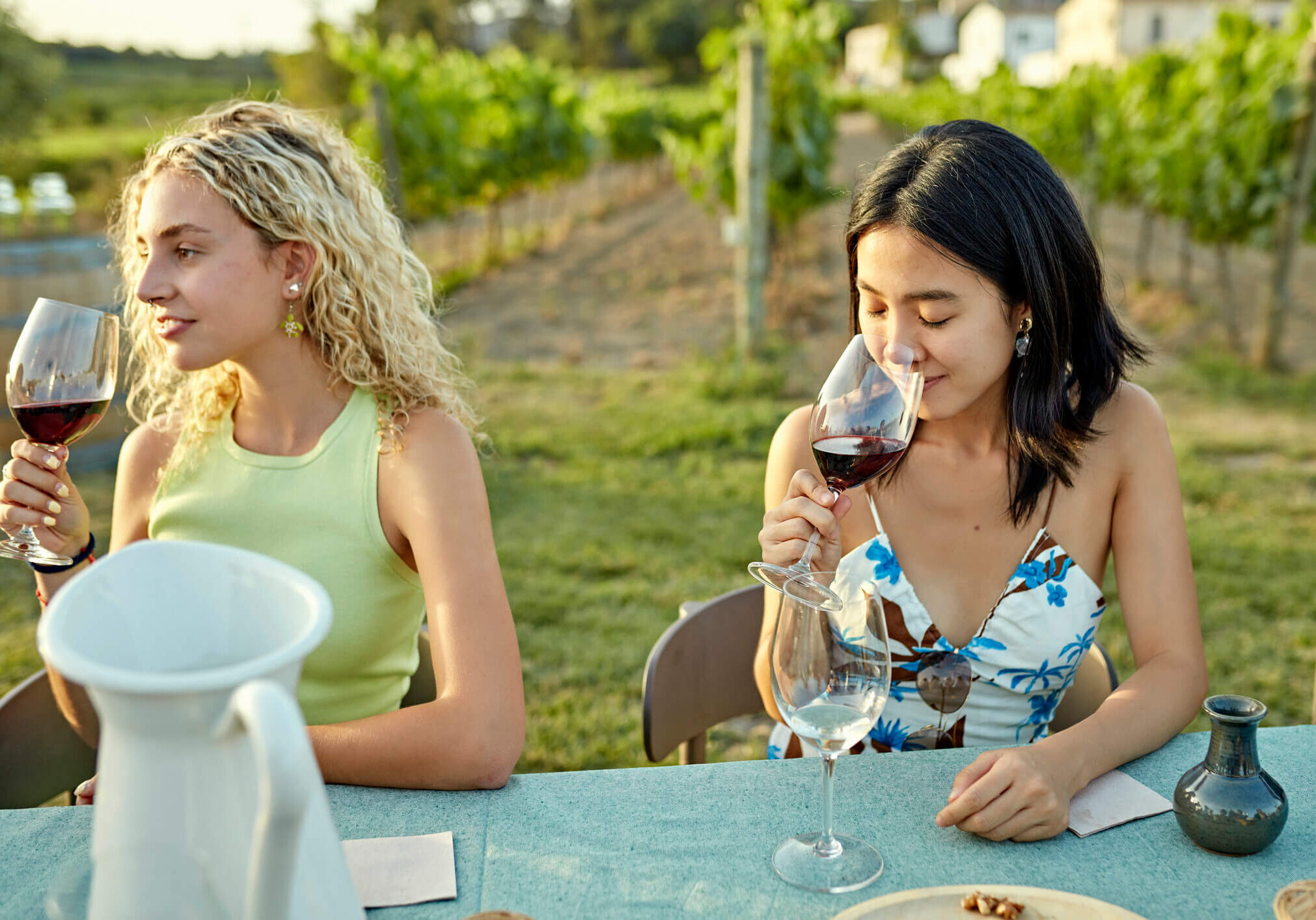 Friends tasting wine outdoors